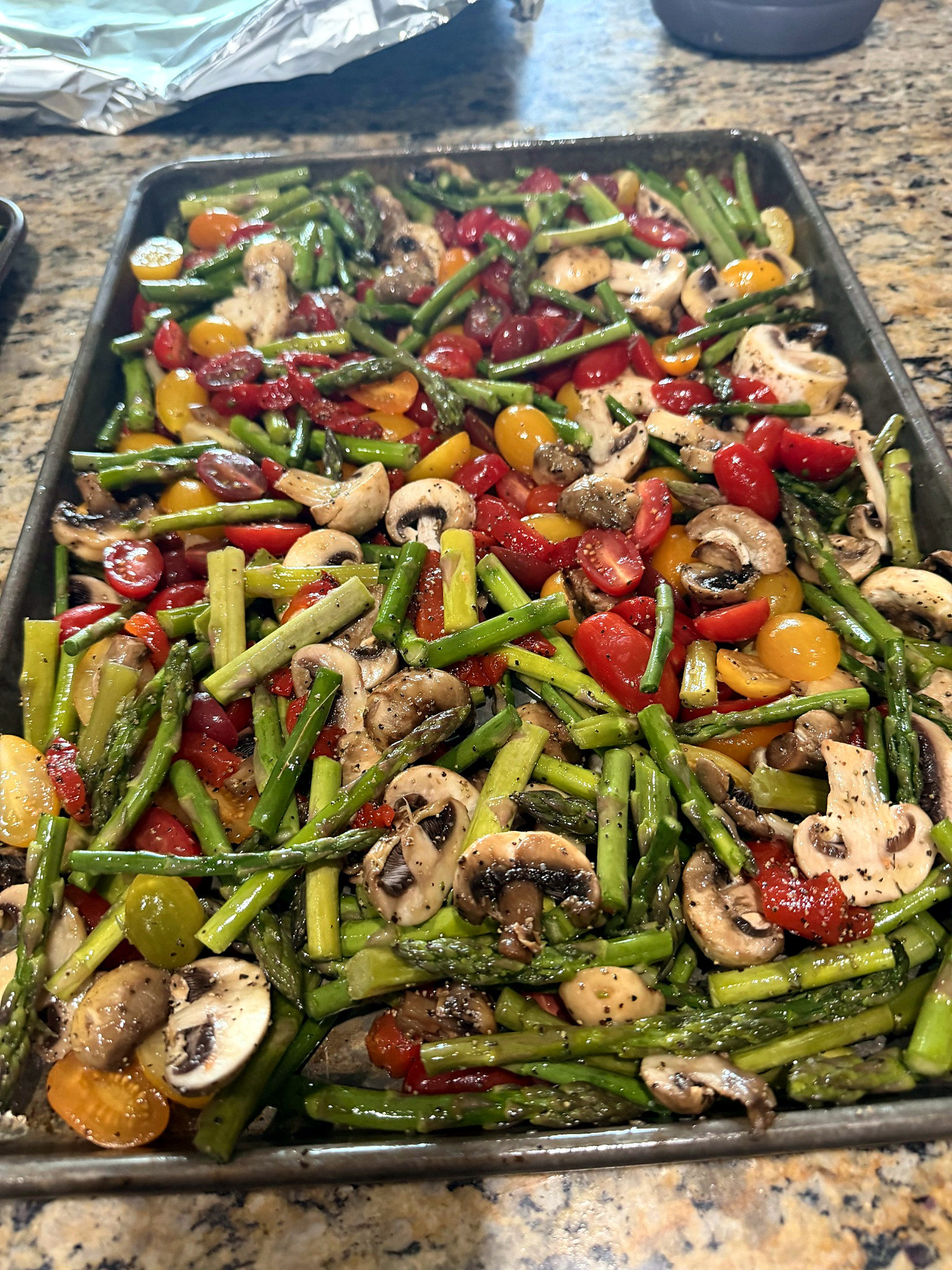 Mixed vegetables with asparagus, mushrooms and cherry tomatoes prepared for catering.
